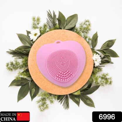 Silicone facial scrubber with heart shape, perfect for exfoliating skin